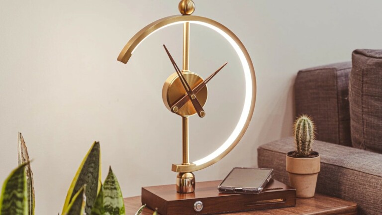 Khonsu Clock Lamp has a wireless-charging design that keeps your everyday devices charged